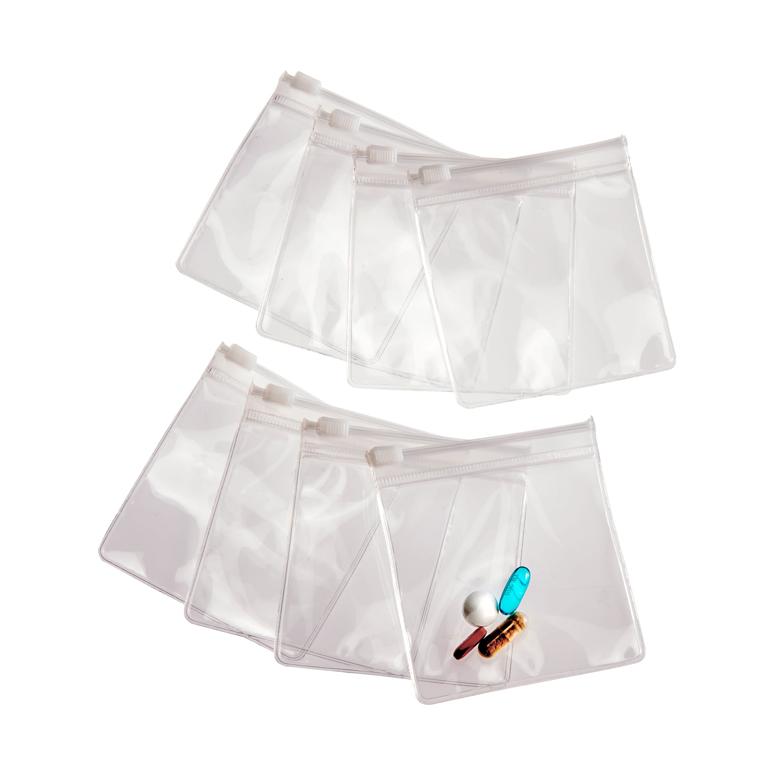 Set of clear plastic pouches with various items on a white background