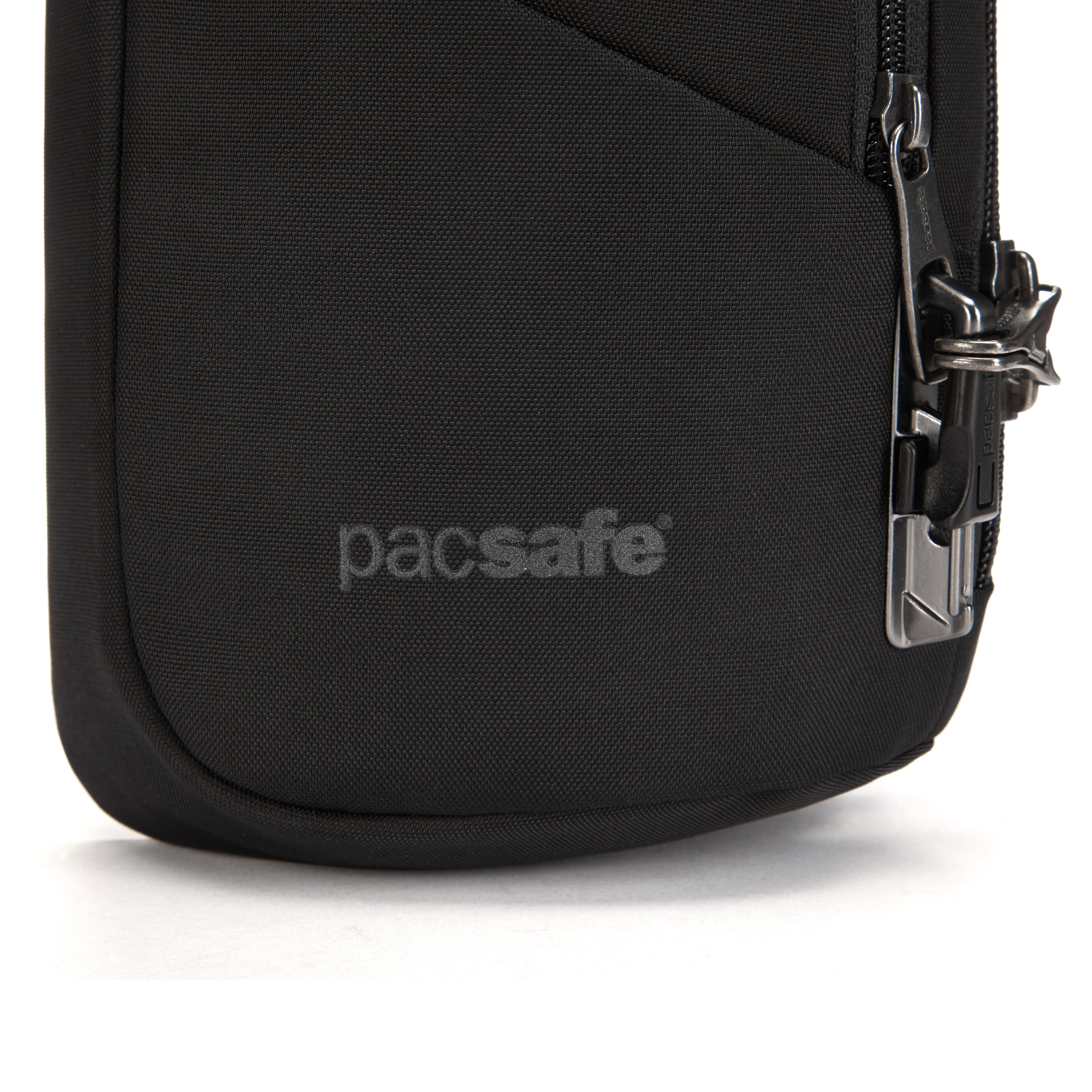 PacSafe V Action Sling Black bag with extra-level lockable zips and a cut-resistant front panel - closeup of zipper. 